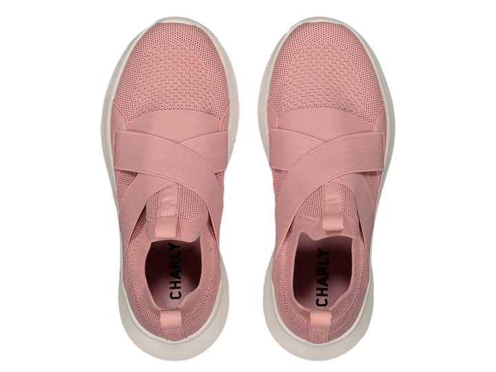 Tenis deportivos Charly color rosa con suela blanca y cintas elásticas cruzadas en la parte superior.