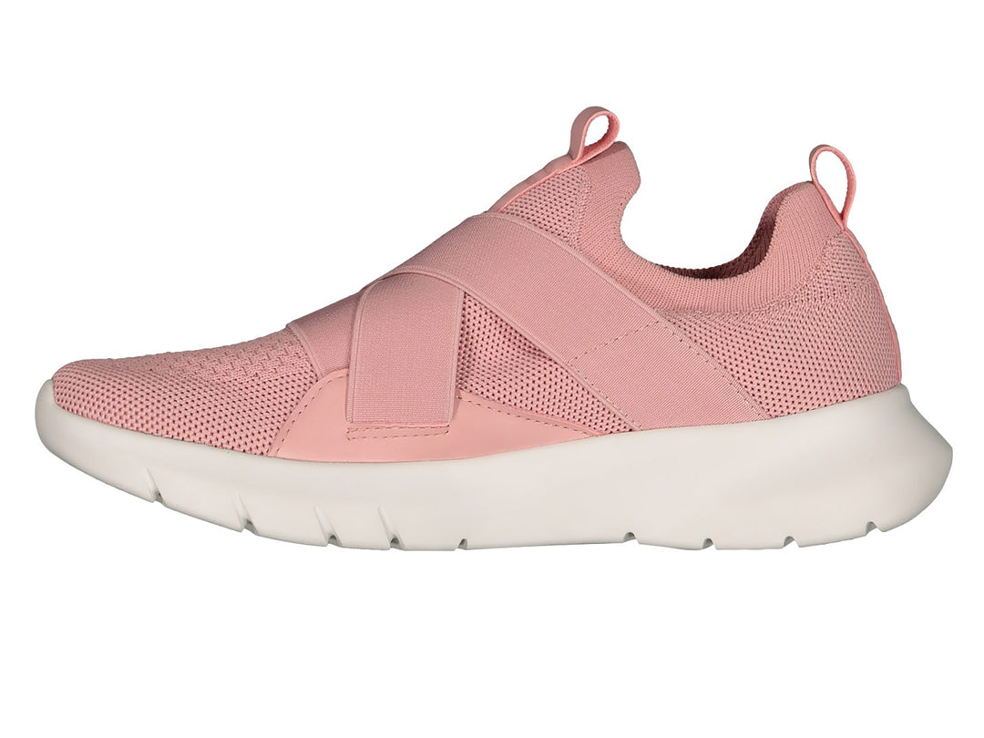 Tenis deportivos Charly color rosa con suela blanca y cintas elásticas cruzadas en la parte superior.