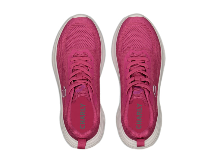 Tenis deportivos Charly de color rosa con suela blanca y tejido transpirable.