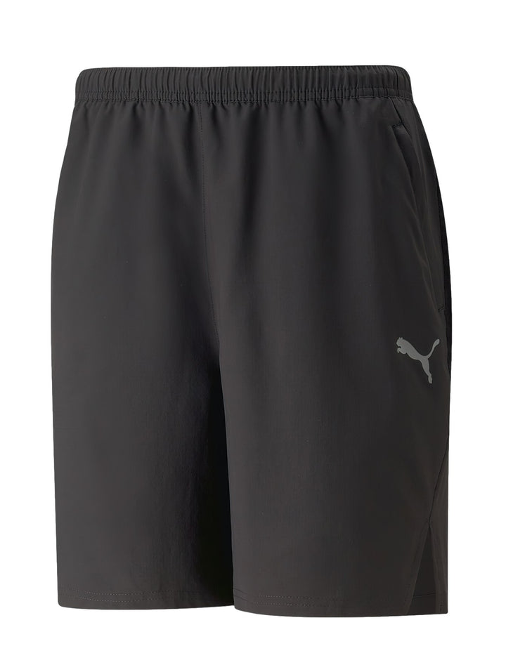 Pantalones cortos deportivos PUMA color negro con logotipo gris en la pierna izquierda y cintura elástica.