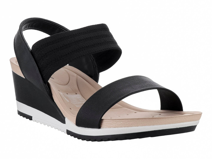 Sandalia Modare de cuña color negro con suela blanca y beige, diseño de correas anchas para mujer.
