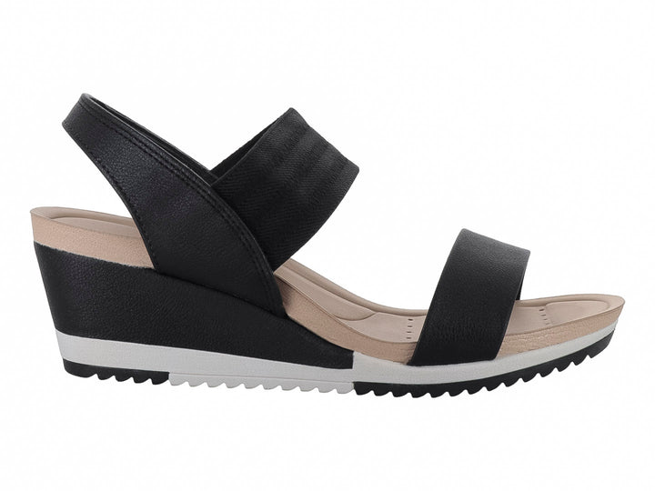 Sandalia Modare de cuña color negro con suela blanca y beige, diseño de correas anchas para mujer.