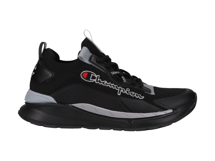 Tenis deportivos Champion en color negro con detalles en gris y logotipo blanco lateral.