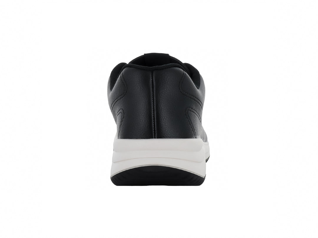 Tenis deportivos color negro con suela blanca y cordones, vista lateral.