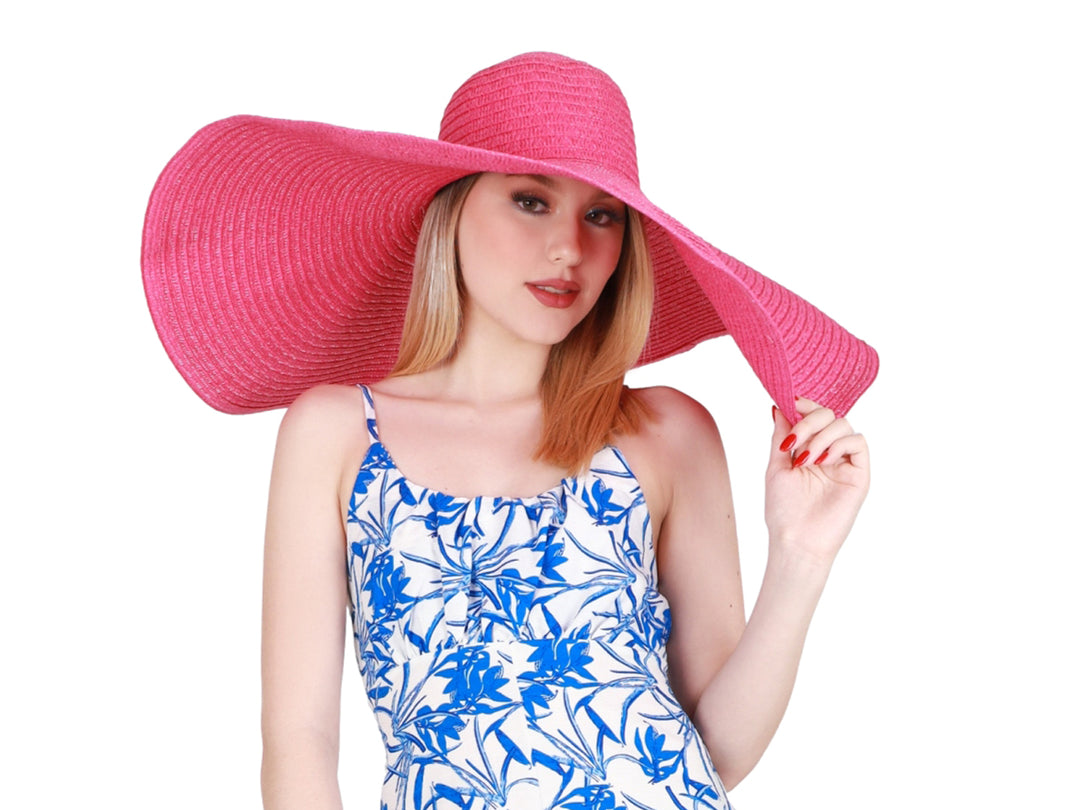 Sombrero de ala ancha color fucsia con acabado tejido.