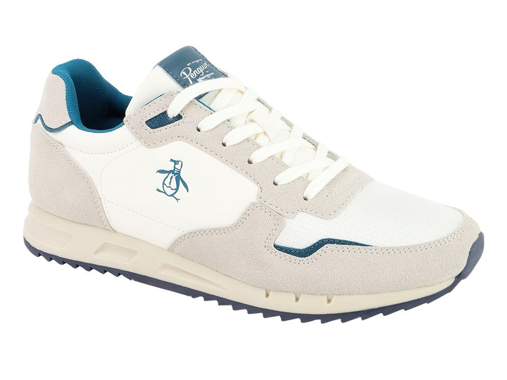 Tenis Penguin Millan en colores beige y blanco con detalles y suela en color azul.