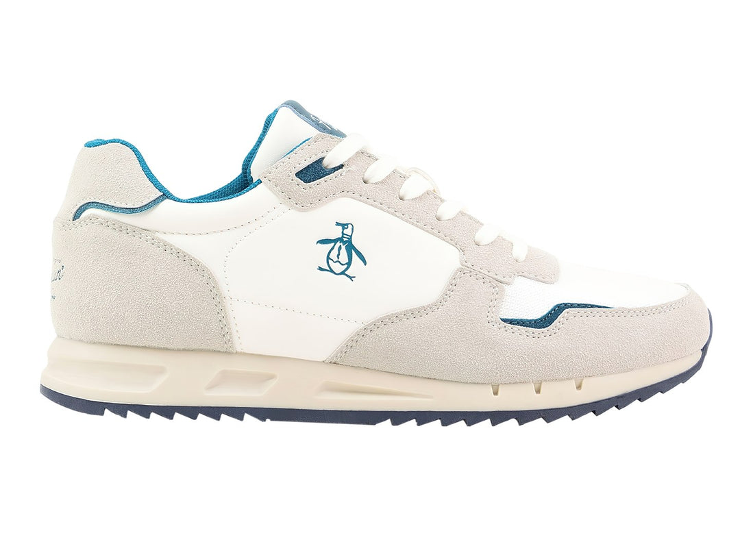 Tenis Penguin Millan en colores beige y blanco con detalles y suela en color azul.