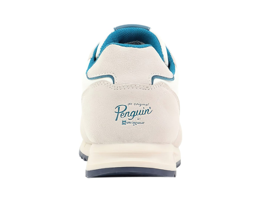 Tenis Penguin Millan en colores beige y blanco con detalles y suela en color azul.