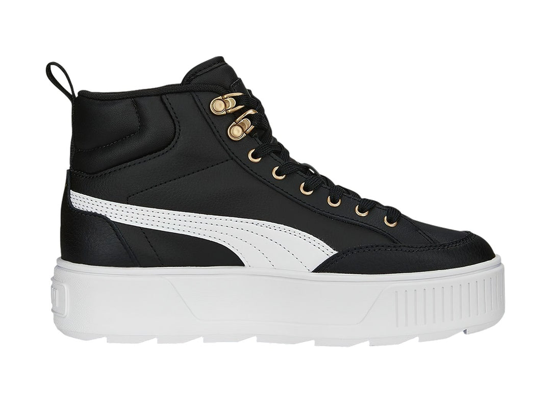 Tenis PUMA Carmen Mid color negro con suela blanca de plataforma y ojillos dorados.