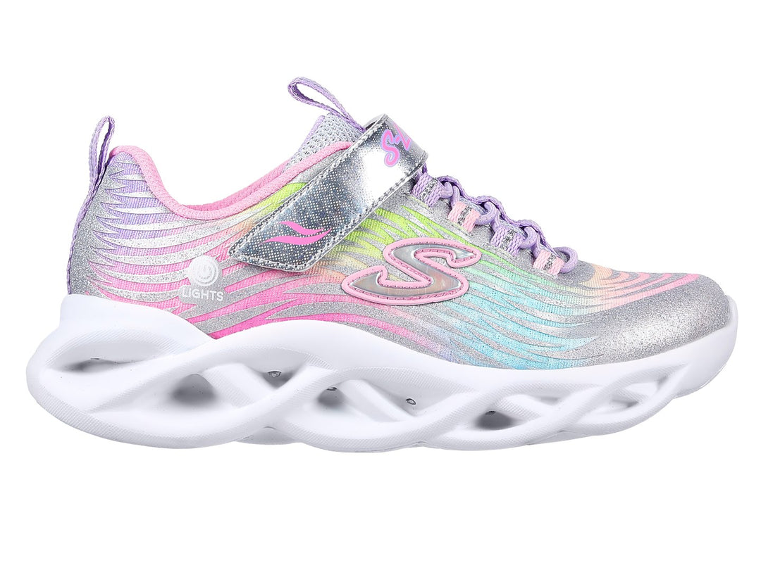 Tenis Skechers Twisty Brights para niña en colores multicolor con suela blanca ondulada y detalles brillantes.