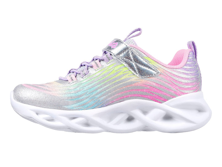 Tenis Skechers Twisty Brights para niña en colores multicolor con suela blanca ondulada y detalles brillantes.