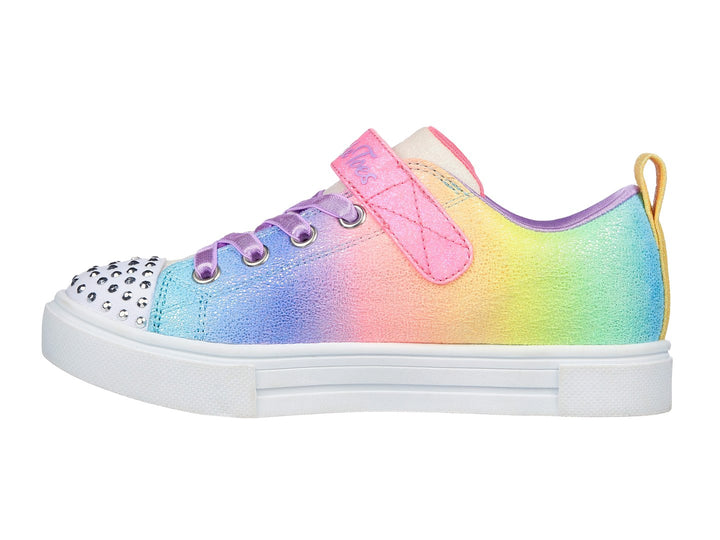 Tenis Skechers para Niña multicolor con estampados de unicornios, arcoíris y detalles brillantes en la punta.