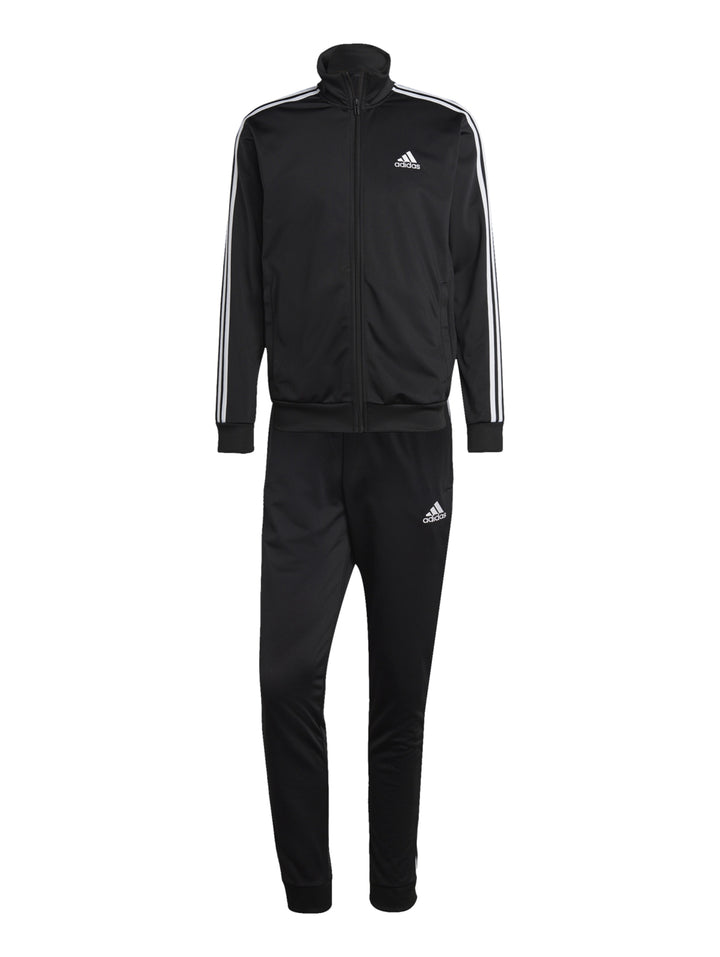 Conjunto deportivo Adidas negro con tres franjas blancas laterales, incluye chaqueta y pantalón.