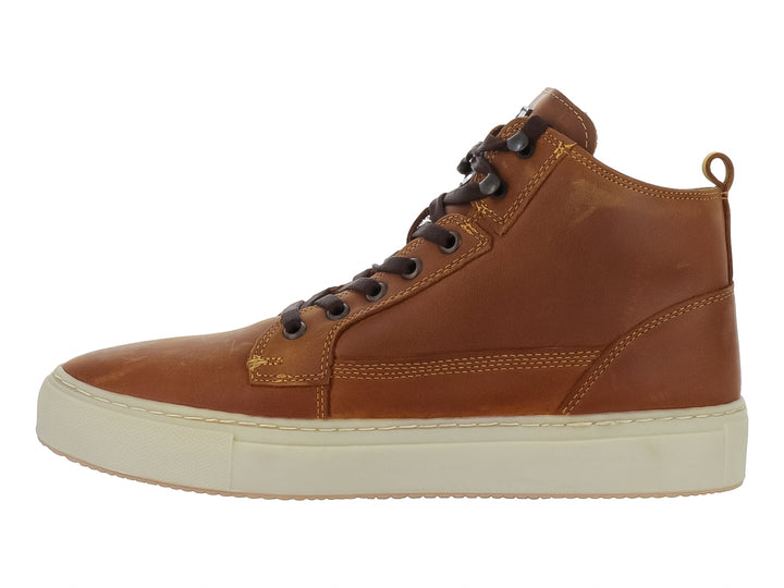 Botín Swissbrand de piel color camel con suela beige y cordones marrón oscuro.