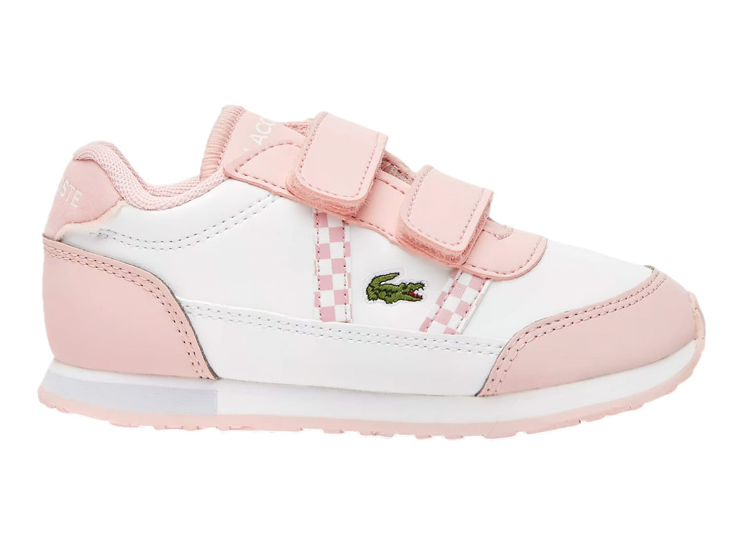 Tenis Lacoste blancos con detalles en rosa y cierres de velcro.