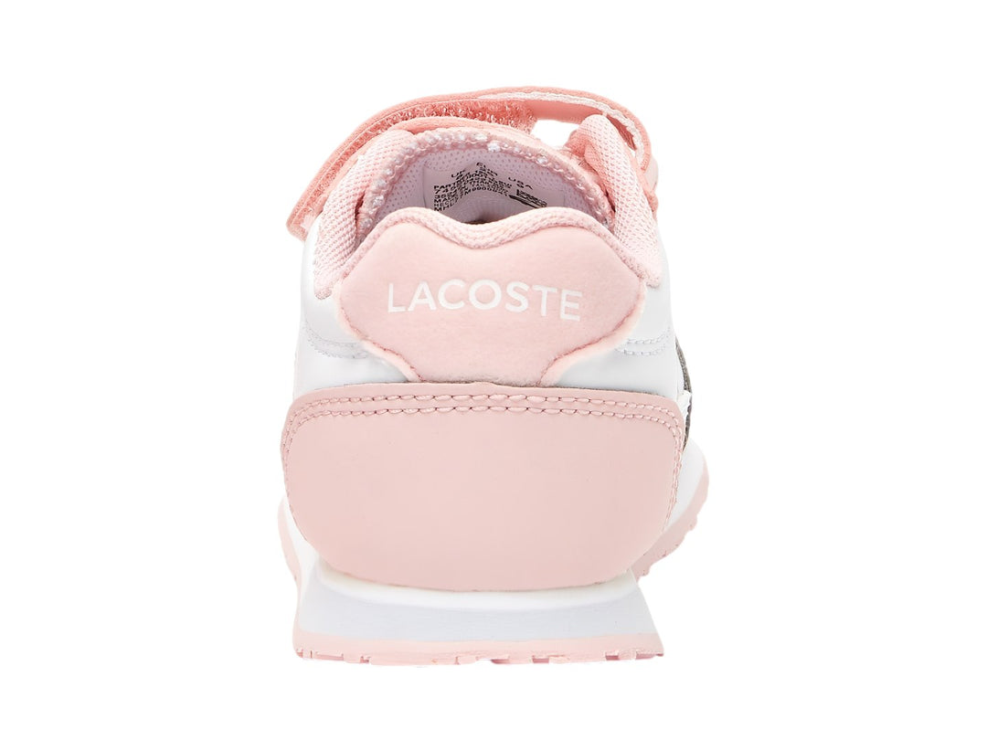 Tenis Lacoste blancos con detalles en rosa y cierres de velcro.
