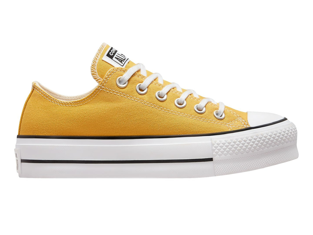 Tenis Converse Chuck Taylor All Star Lift Ox en color amarillo con suela blanca de plataforma y detalles en negro.