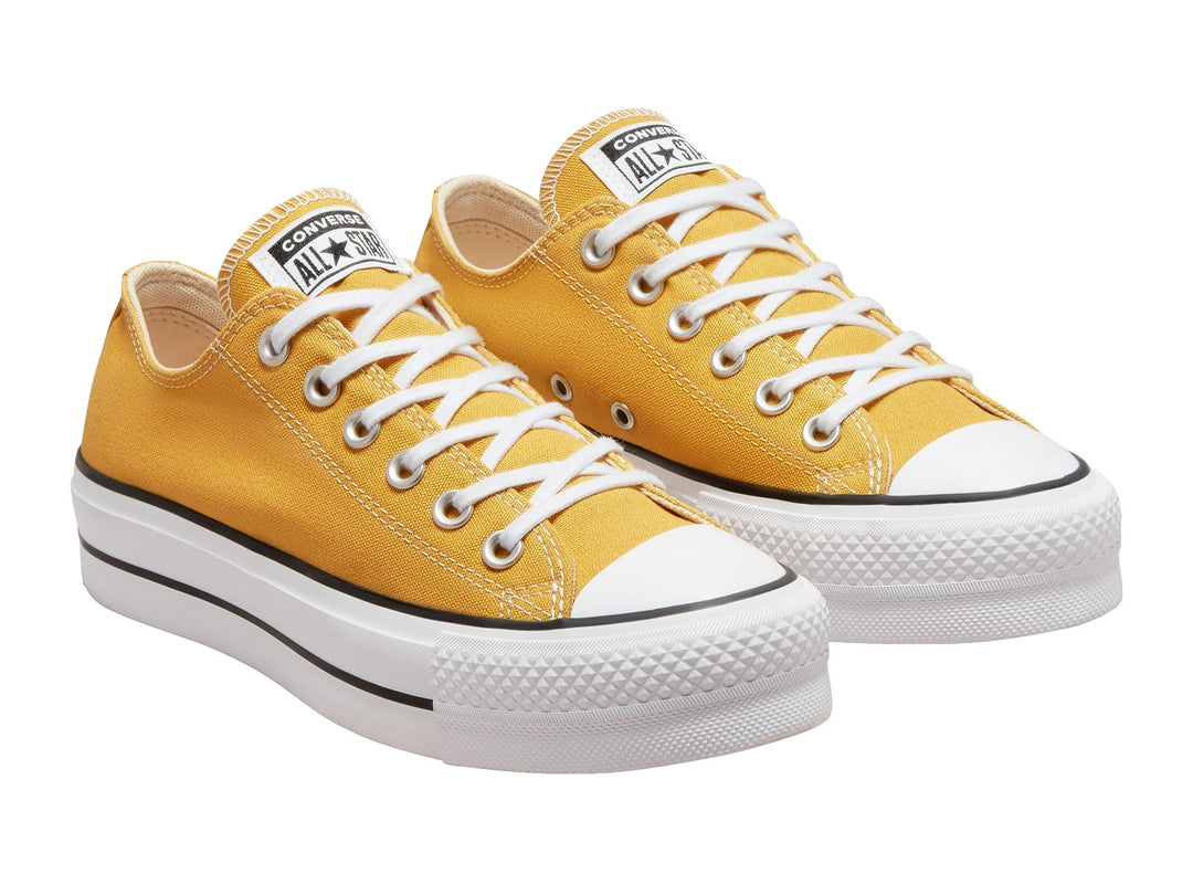 Tenis Converse Chuck Taylor All Star Lift Ox en color amarillo con suela blanca de plataforma y detalles en negro.