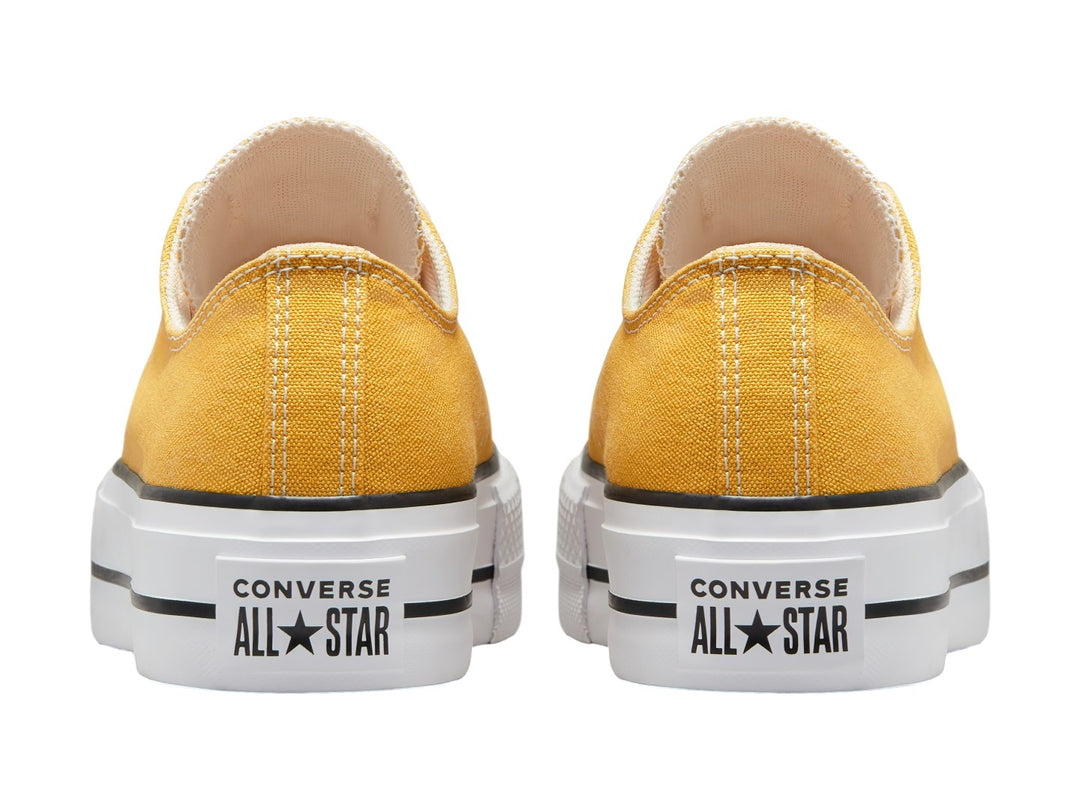 Tenis Converse Chuck Taylor All Star Lift Ox en color amarillo con suela blanca de plataforma y detalles en negro.