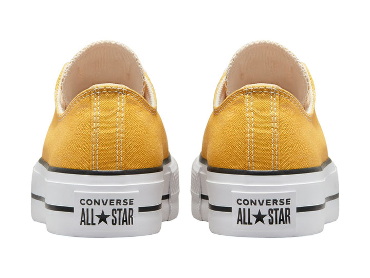 Tenis Converse Chuck Taylor All Star Lift Ox en color amarillo con suela blanca de plataforma y detalles en negro.