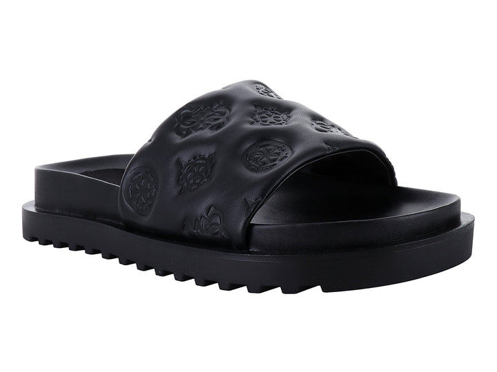 Sandalia negra GUESS con correa grabada y suela de plataforma dentada.