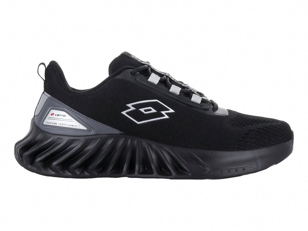 Tenis deportivo Lotto color negro con suela gruesa y texturizada.