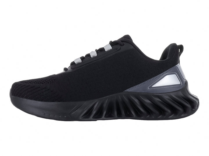 Tenis deportivo Lotto color negro con suela gruesa y texturizada.