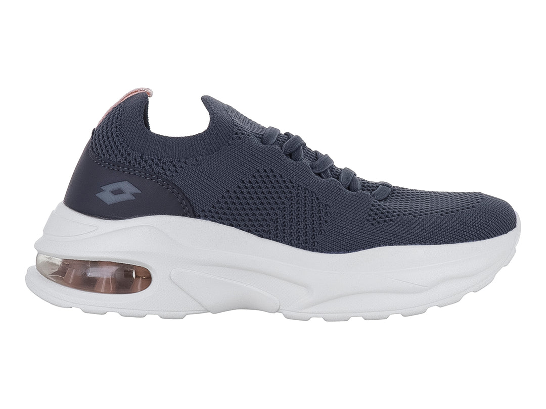 Tenis deportivos Lotto color Oxford con suela blanca ancha y cámara de aire en el talón.
