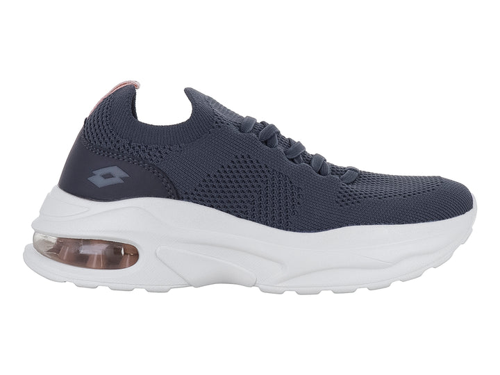 Tenis deportivos Lotto color Oxford con suela blanca ancha y cámara de aire en el talón.