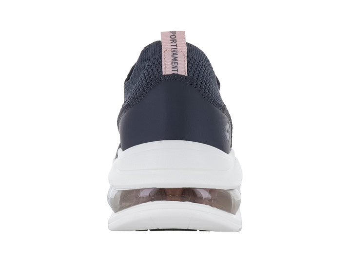 Tenis deportivos Lotto color Oxford con suela blanca ancha y cámara de aire en el talón.