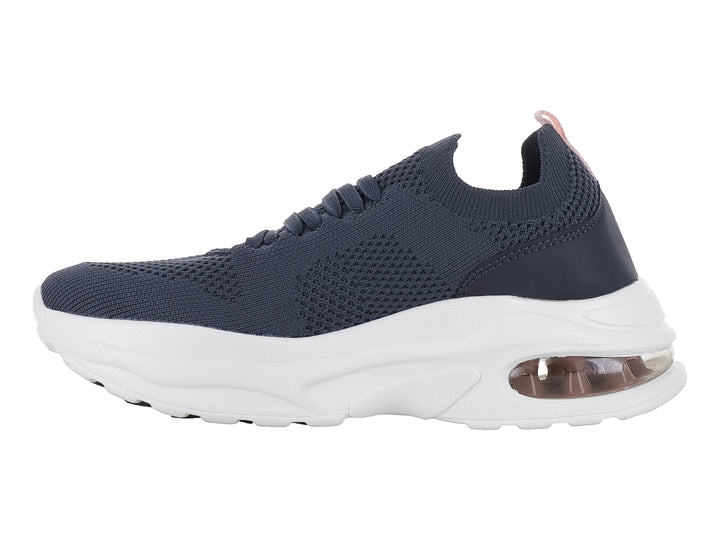 Tenis deportivos Lotto color Oxford con suela blanca ancha y cámara de aire en el talón.