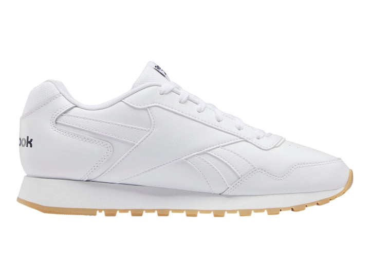 Tenis Reebok Glide en color blanco con suela de goma beige, diseño deportivo y minimalista.