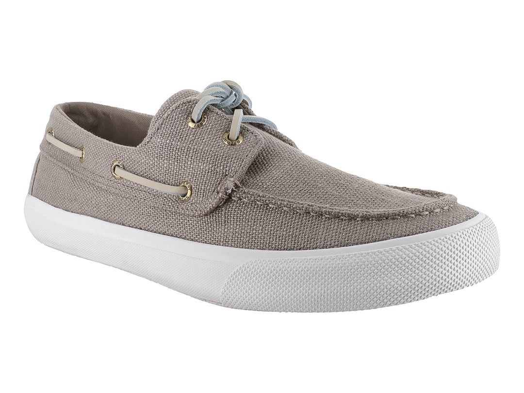Zapato náutico Sperry color taupe con suela blanca y cordones azul claro.