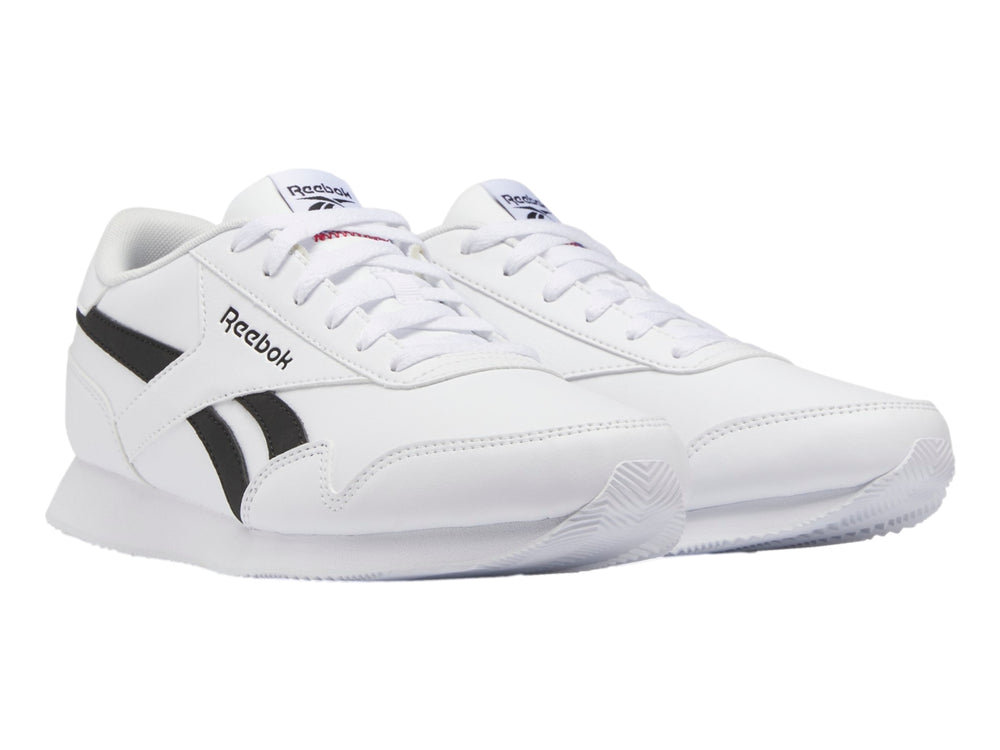 Tenis deportivos Reebok color blanco con franjas negras laterales y suela blanca.