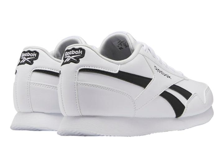 Tenis deportivos Reebok color blanco con franjas negras laterales y suela blanca.