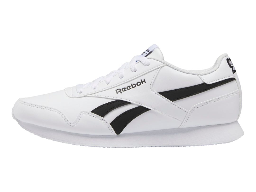 Tenis deportivos Reebok color blanco con franjas negras laterales y suela blanca.