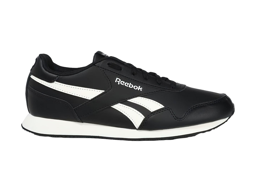Tenis deportivos Reebok color negro con franjas y suela blanca.