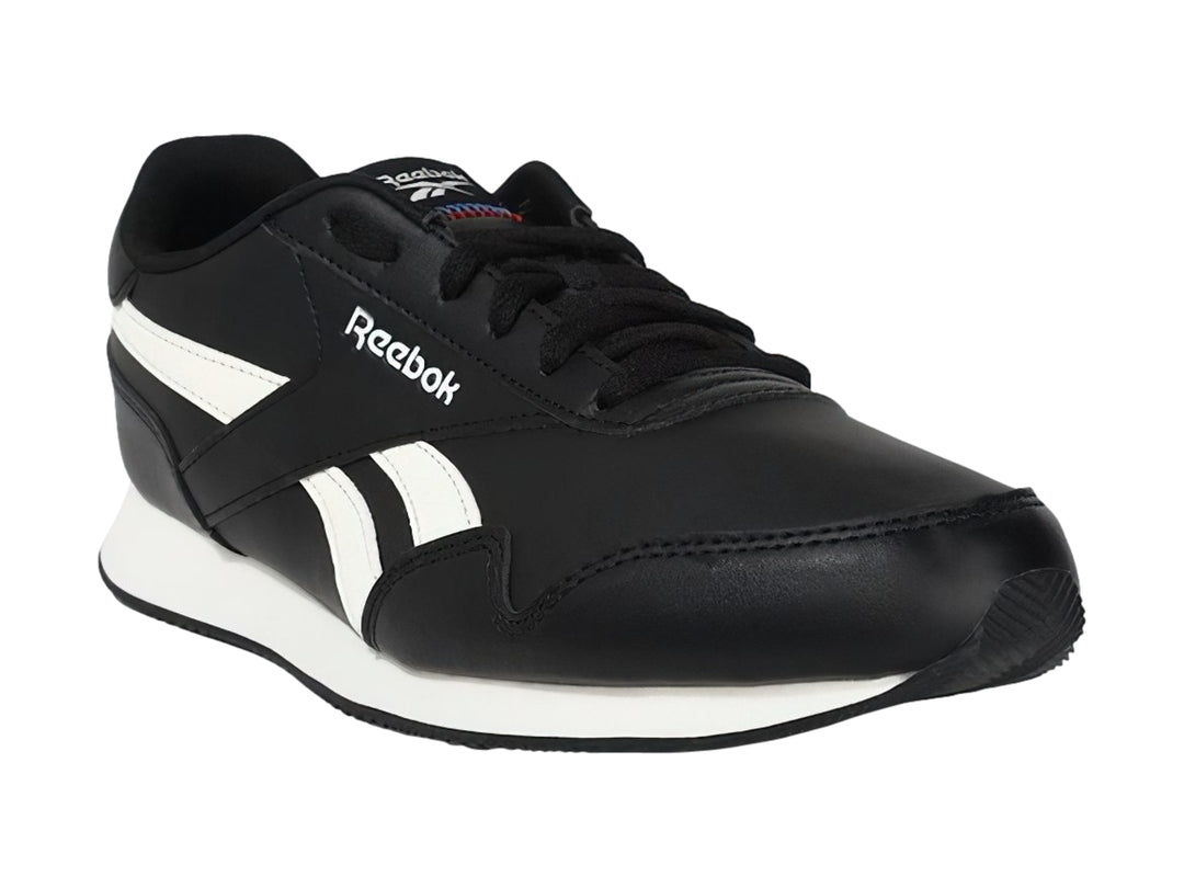 Tenis deportivos Reebok color negro con franjas y suela blanca.
