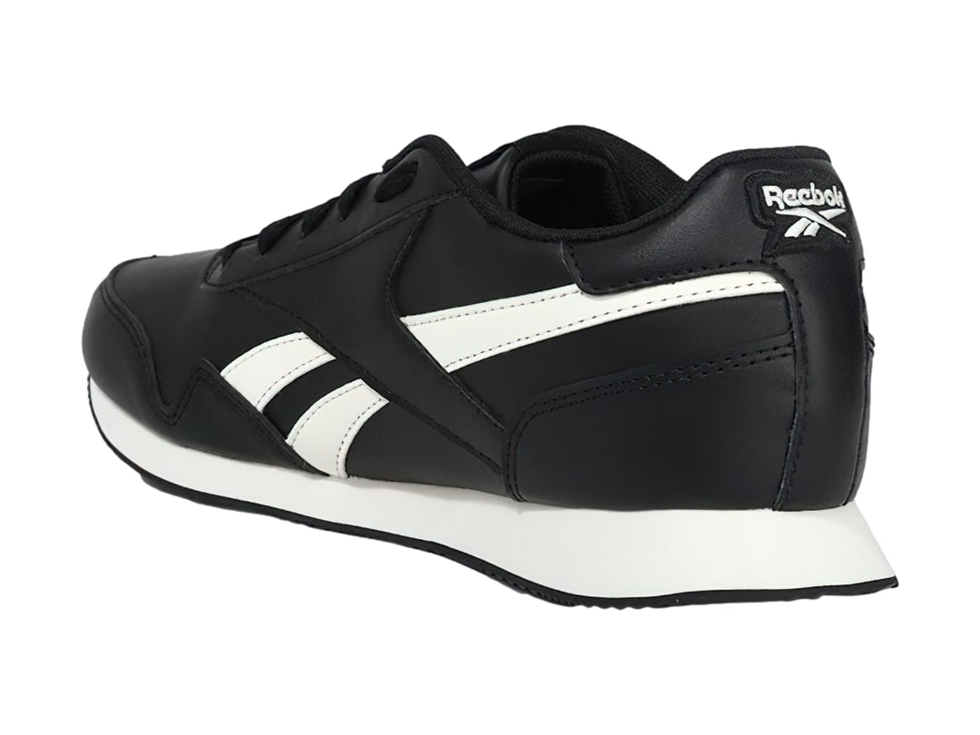 Tenis deportivos Reebok color negro con franjas y suela blanca.