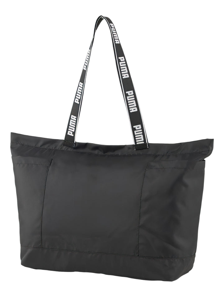 Bolsa de hombro PUMA Core Base Large Shopper en color negro con logotipo blanco frontal y asas con texto.
