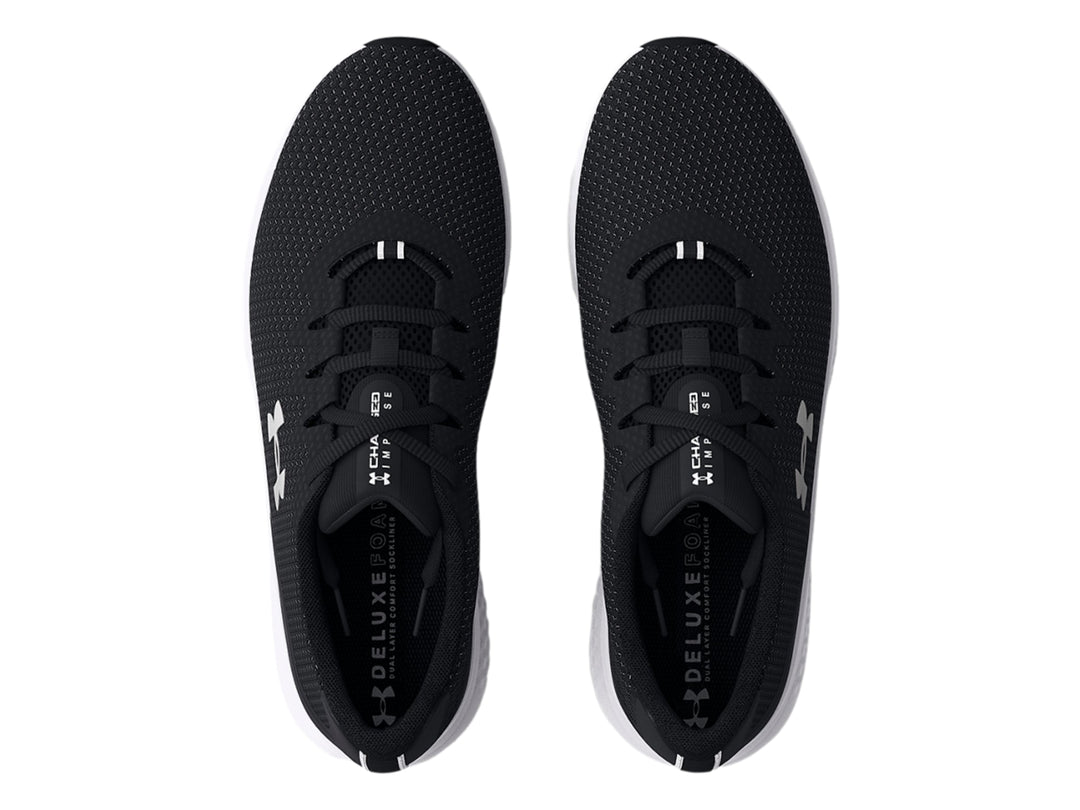 Tenis deportivos Under Armour Charged Impulse 3 en color negro con suela blanca y logo plateado lateral.