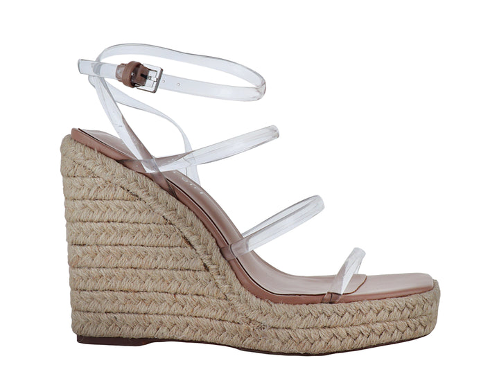 Sandalia Madden Girl con tiras transparentes y plataforma de cuña en color beige natural.