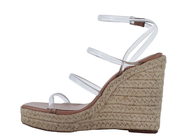 Sandalia Madden Girl con tiras transparentes y plataforma de cuña en color beige natural.