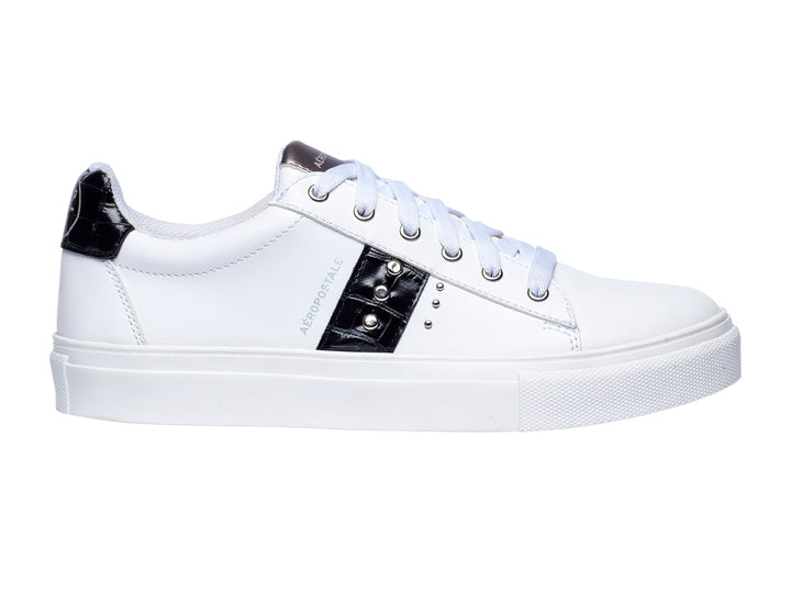 Tenis blancos Aeropostale con franja negra lateral y suela blanca de plataforma.