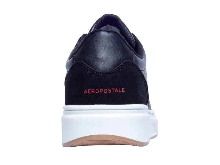 Tenis deportivos Aeropostale color negro con detalles en rojo y suela blanca.