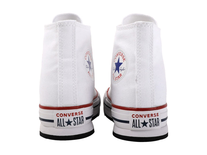 Tenis Converse Chuck Taylor All Star blancos de corte alto con suela EVA Lift y detalles en rojo y azul.