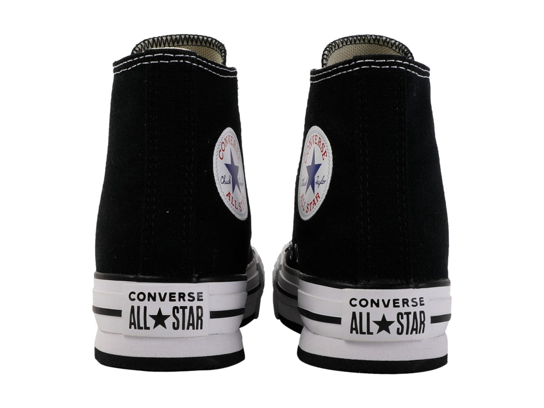 Tenis Converse Chuck Taylor All Star de bota color negro con suela blanca de plataforma.