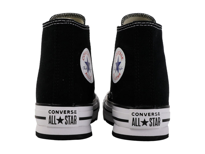 Tenis Converse Chuck Taylor All Star de bota color negro con suela blanca de plataforma.