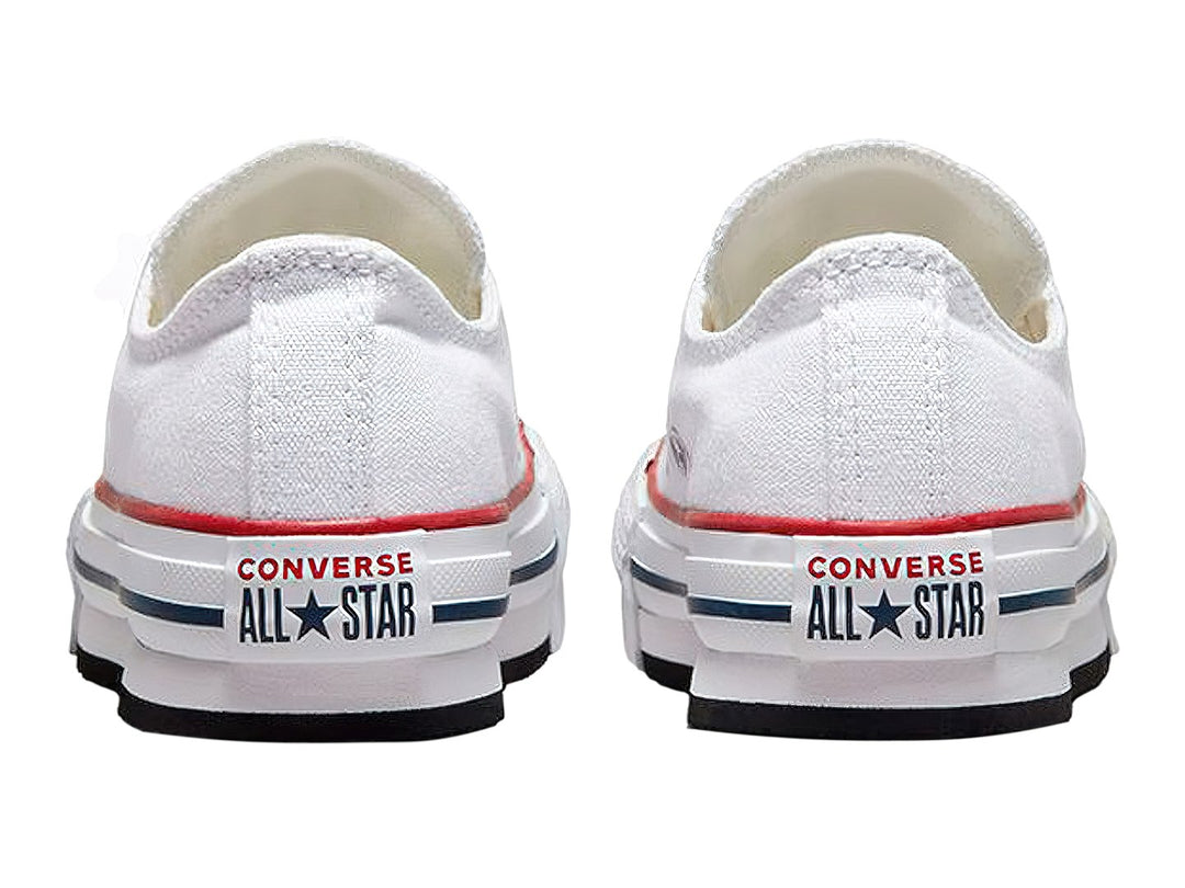 Tenis Converse Chuck Taylor All Star Eva Lift Ox en color blanco con franjas roja y azul en la suela.