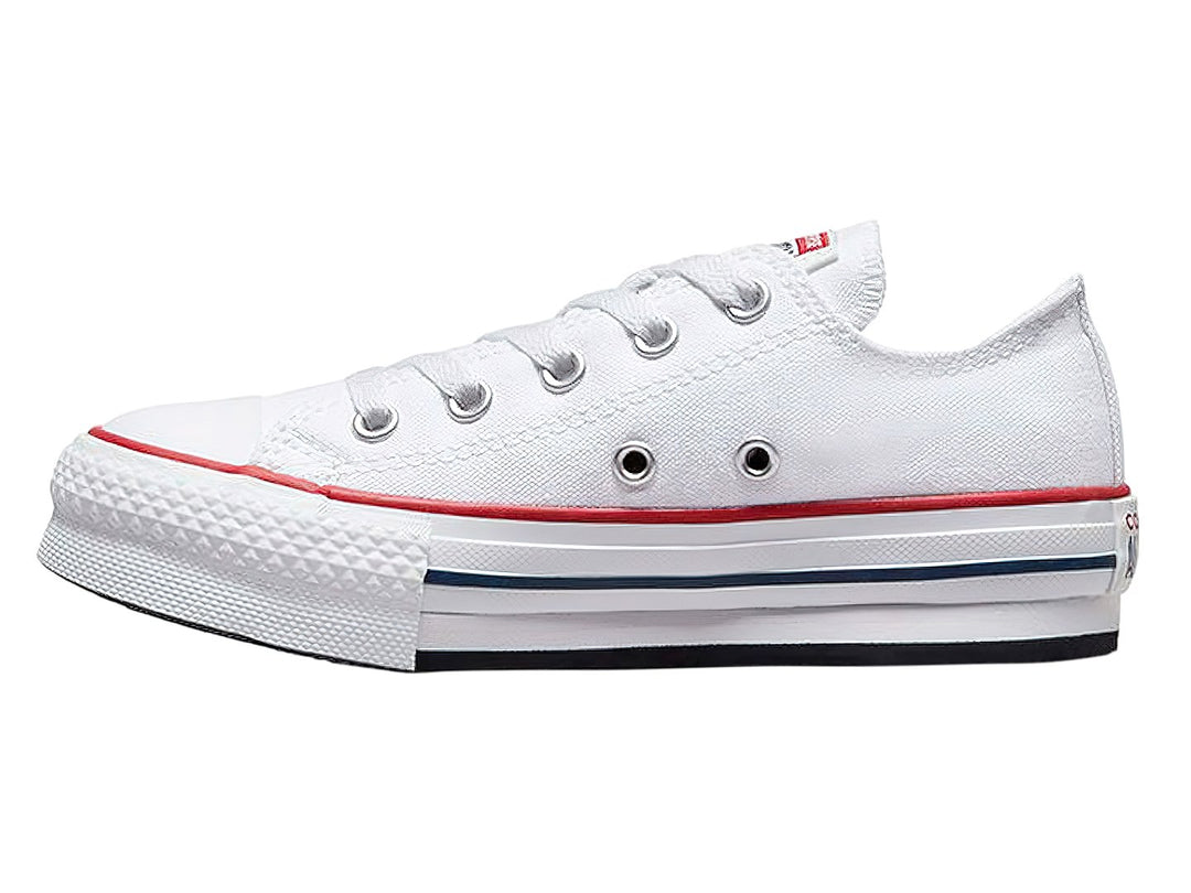 Tenis Converse Chuck Taylor All Star Eva Lift Ox en color blanco con franjas roja y azul en la suela.
